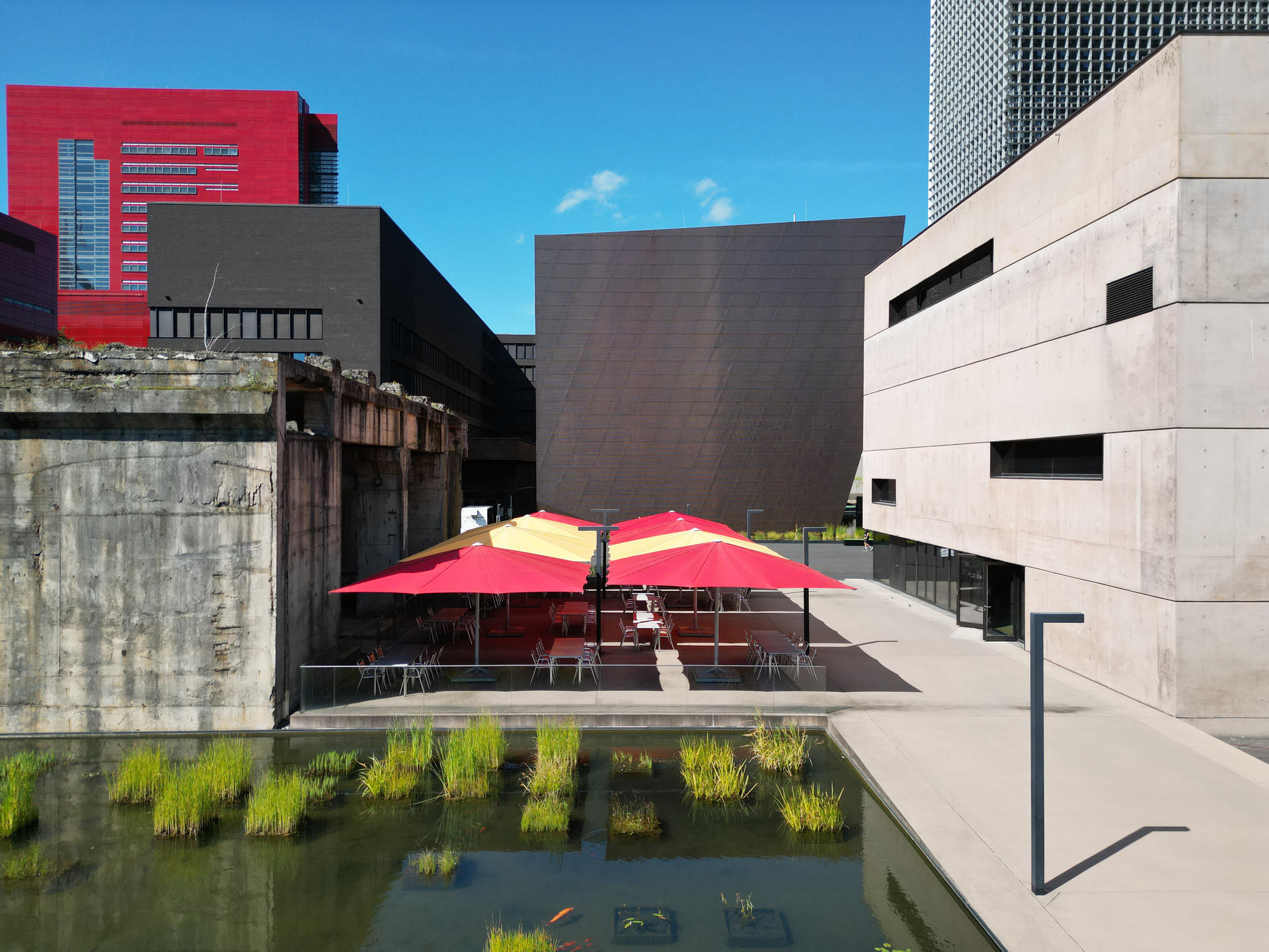 Terrace with red and yellow parasols